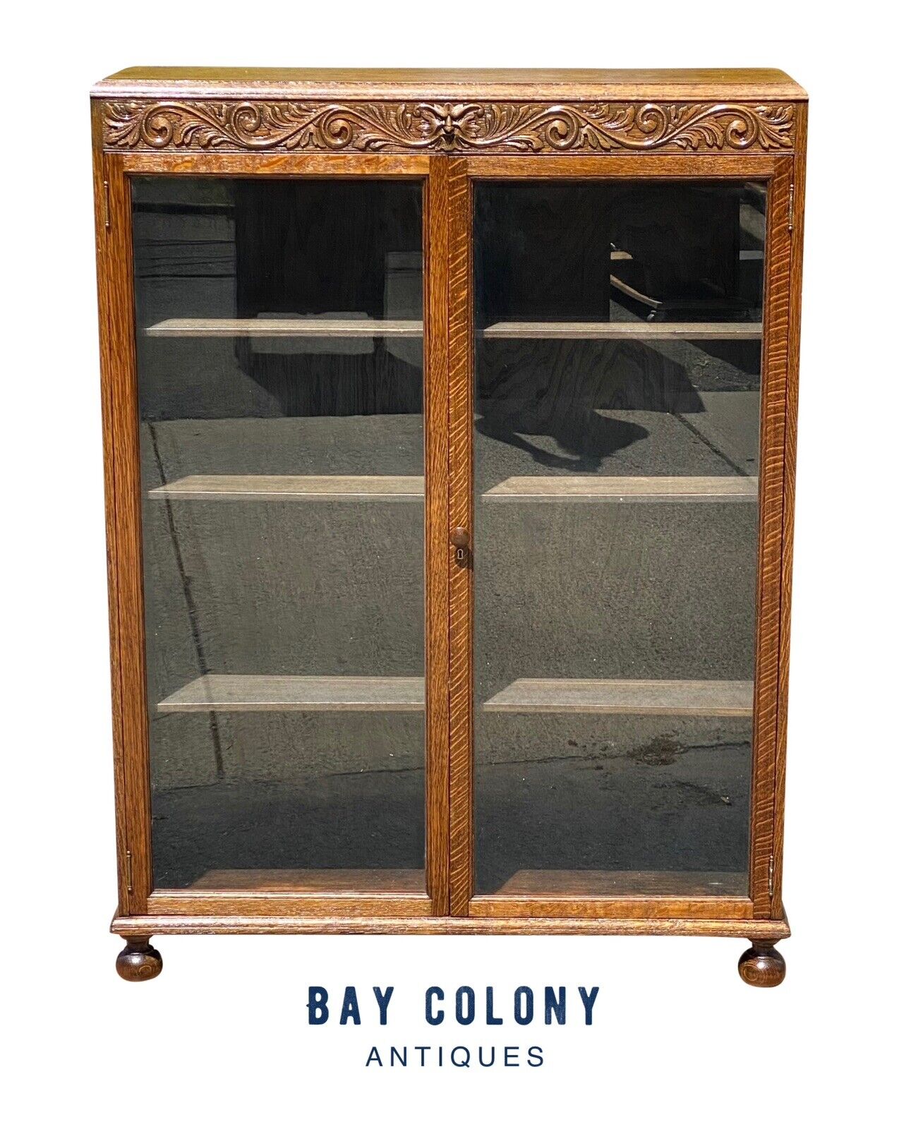 Antique Victorian Tiger Oak Double Door Bookcase With Grotesque Carved Frieze - Bay Colony Antiques Antiques:Furniture:Bookcases