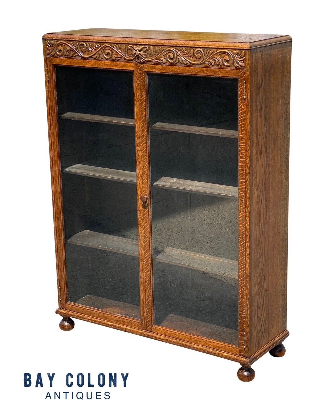 Antique Victorian Tiger Oak Double Door Bookcase With Grotesque Carved Frieze - Bay Colony Antiques Antiques:Furniture:Bookcases