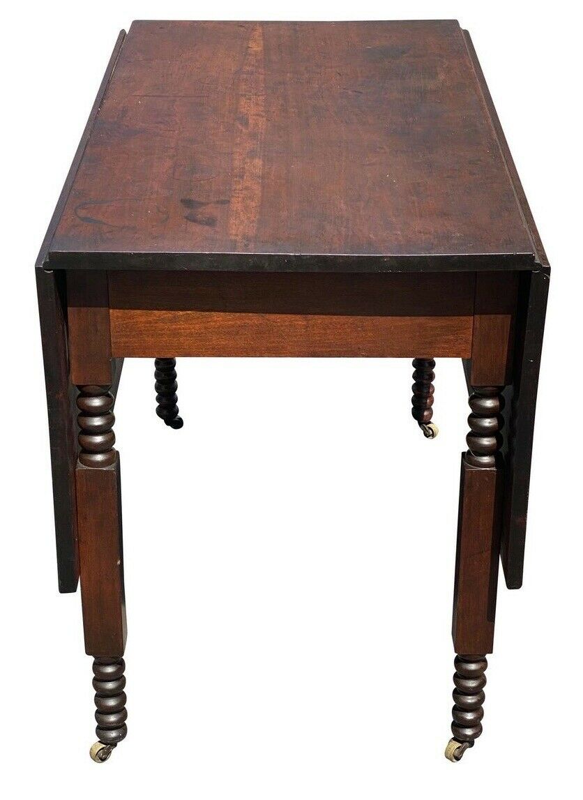 19TH C ANTIQUE SHERATON FIGURED CHERRY DROP LEAF DINING TABLE  W/ SPOOL CARVINGS