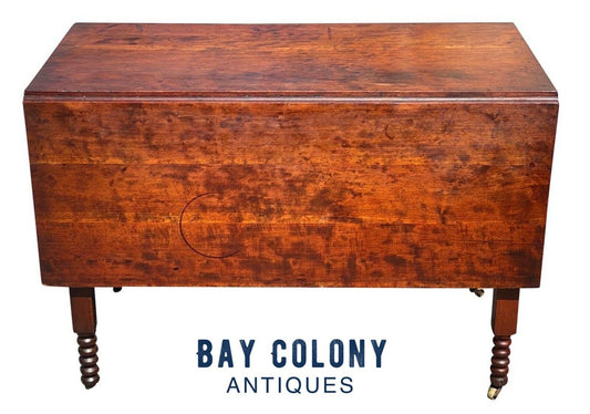 19TH C ANTIQUE SHERATON FIGURED CHERRY DROP LEAF DINING TABLE  W/ SPOOL CARVINGS