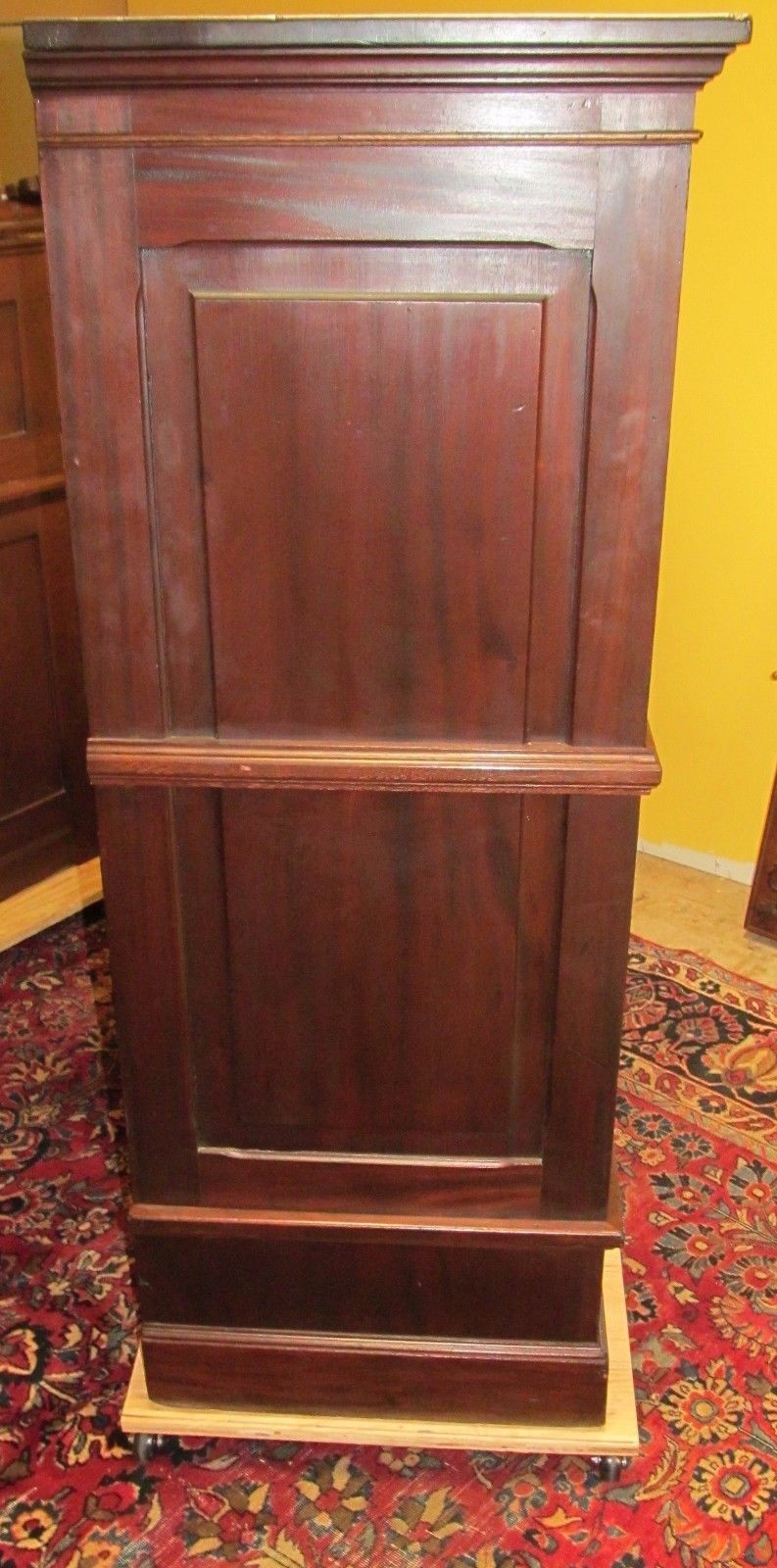 ANTIQUE RAISED PANELED BOOKCASE IN SOLID MAHOGANY-HOLDS ENCYCLOPEDIA SIZED BOOKS