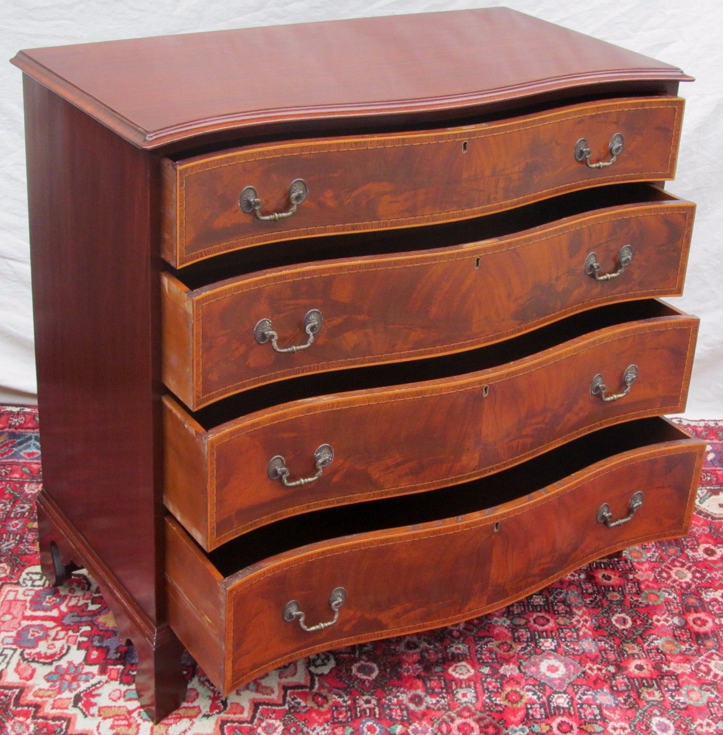 PAIR OF CHIPPENDALE SERPENTINE INLAID MAHOGANY BACHELORS DRESSERS BY J. GERTE