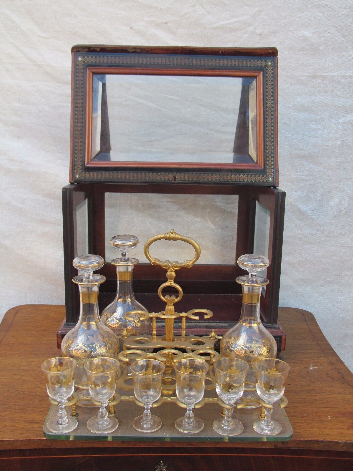 ANTIQUE DECORATED LIQUOR TANTALUS WITH BRASS & ROSEWOOD INLAYS