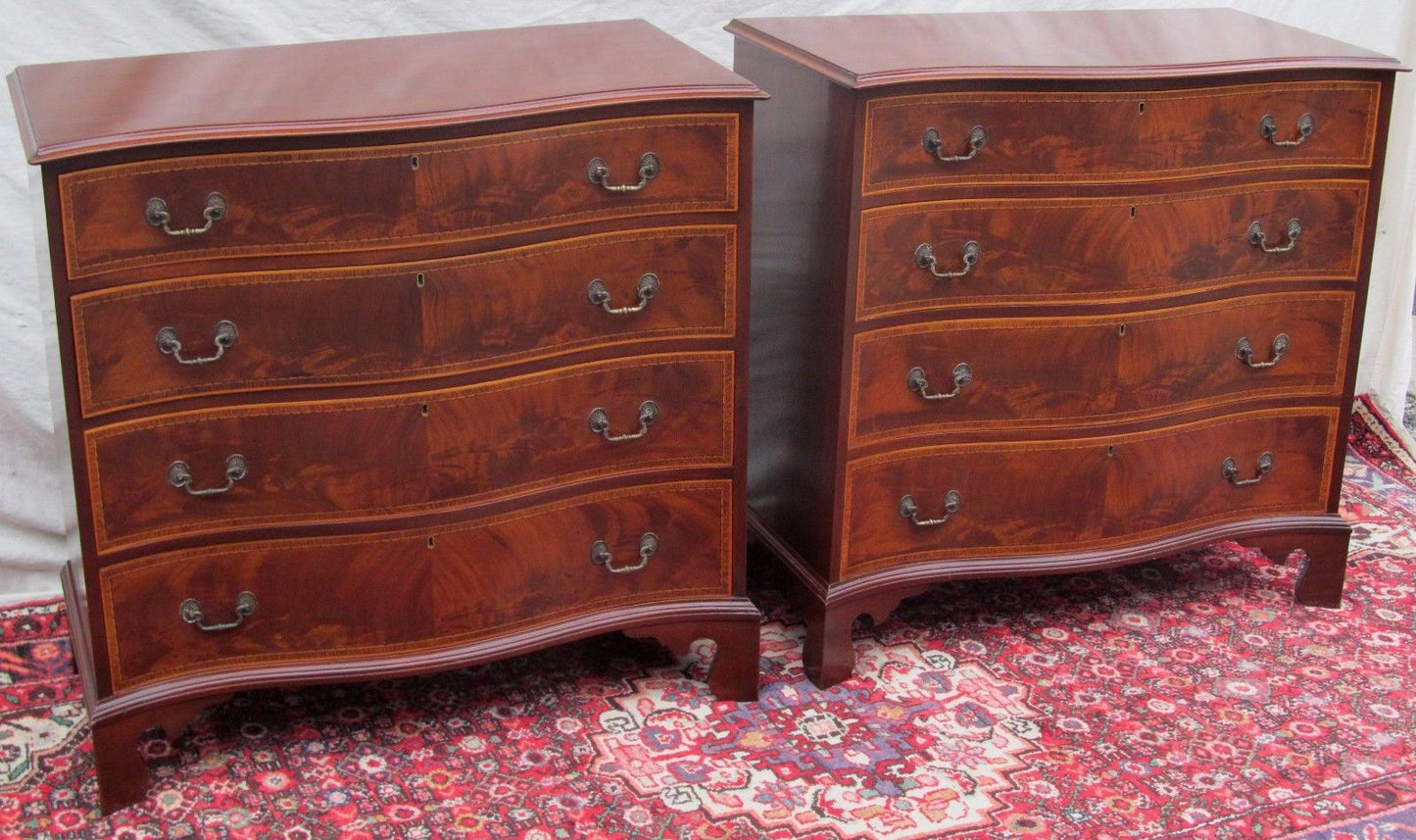 PAIR OF CHIPPENDALE SERPENTINE INLAID MAHOGANY BACHELORS DRESSERS BY J. GERTE