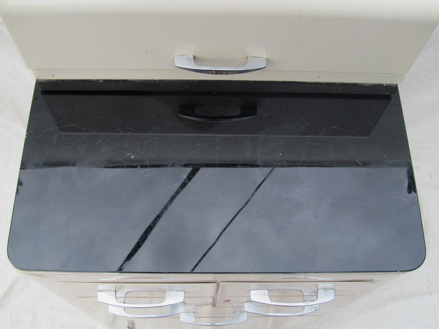 ART DECO ENAMELED MEDICAL CABINET WITH JET BLACK GLASS TOP BY CERTIFIED