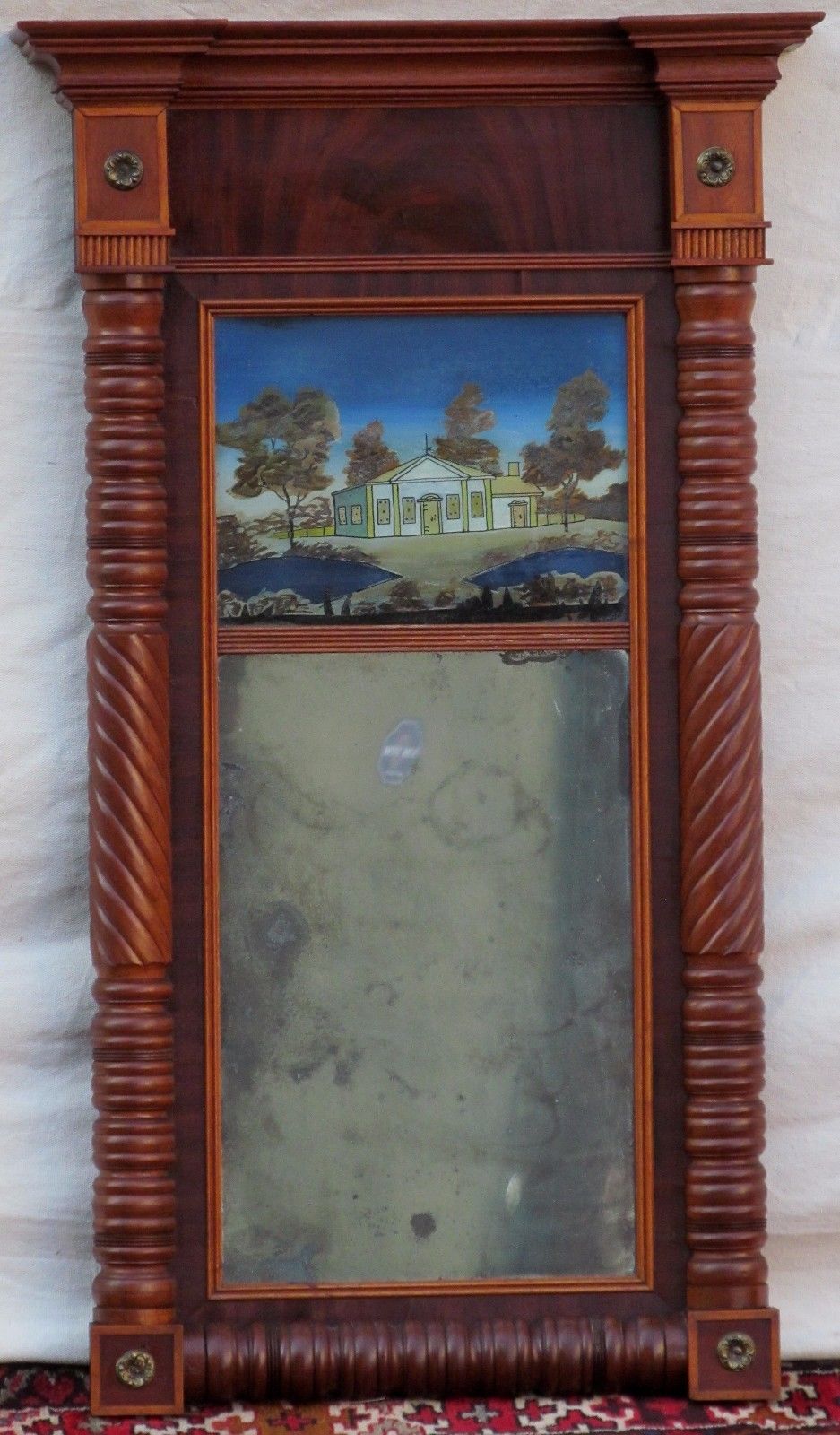 FEDERAL PERIOD REVERSE PAINTED DECORATIVE MIRROR IN CARVED MAHOGANY FRAME