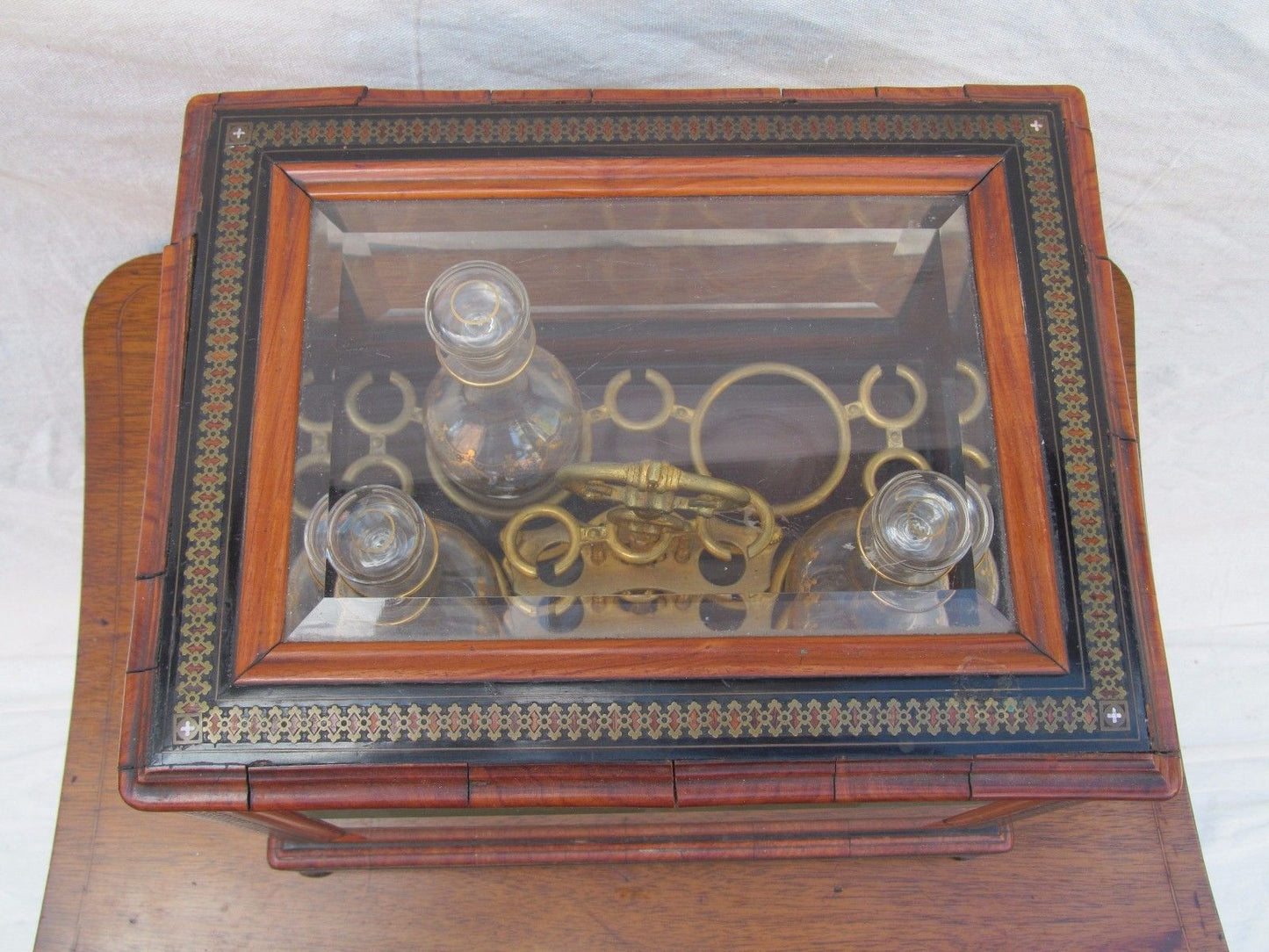 ANTIQUE DECORATED LIQUOR TANTALUS WITH BRASS & ROSEWOOD INLAYS