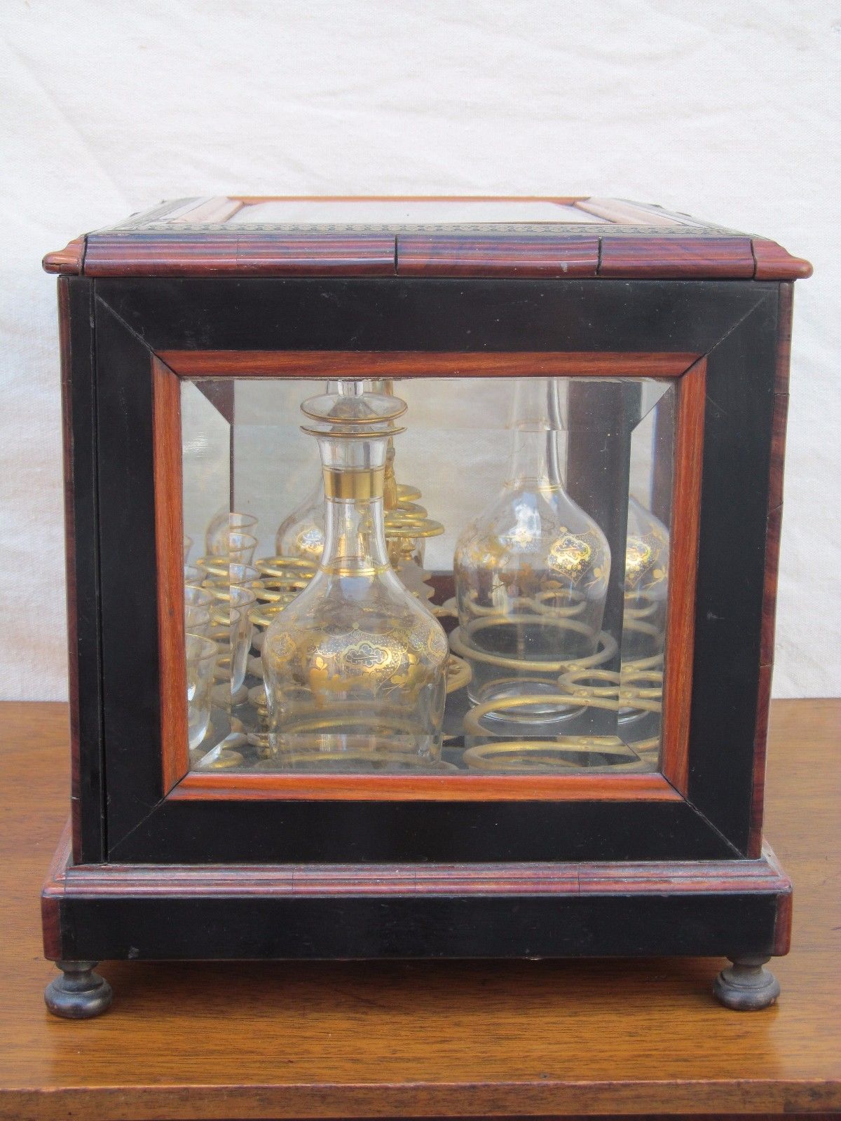 ANTIQUE DECORATED LIQUOR TANTALUS WITH BRASS & ROSEWOOD INLAYS