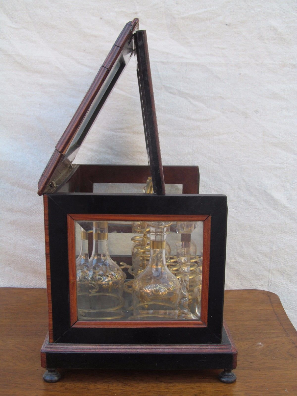 ANTIQUE DECORATED LIQUOR TANTALUS WITH BRASS & ROSEWOOD INLAYS