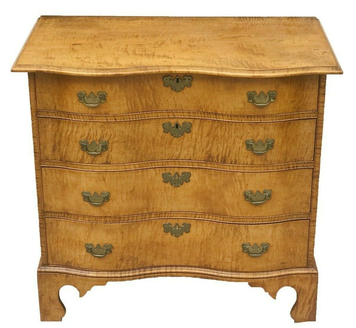 An American Tiger Maple Serpentine Chest An American Tiger Maple Serpentine Chest