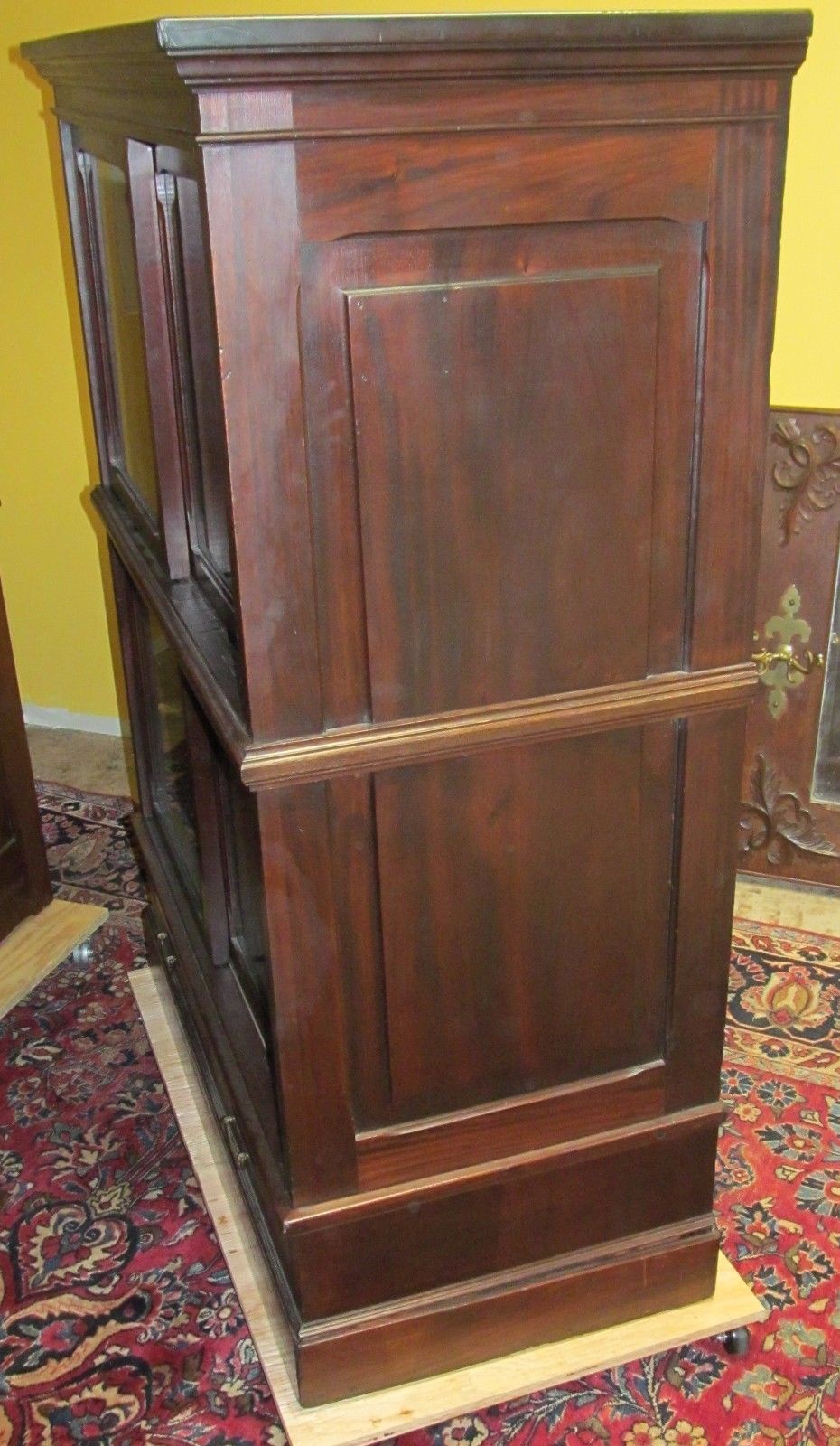 ANTIQUE RAISED PANELED BOOKCASE IN SOLID MAHOGANY-HOLDS ENCYCLOPEDIA SIZED BOOKS