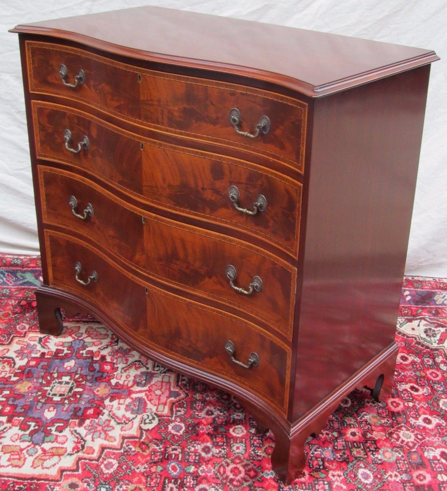 PAIR OF CHIPPENDALE SERPENTINE INLAID MAHOGANY BACHELORS DRESSERS BY J. GERTE