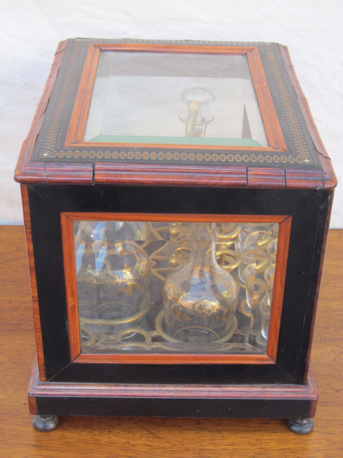 ANTIQUE DECORATED LIQUOR TANTALUS WITH BRASS & ROSEWOOD INLAYS