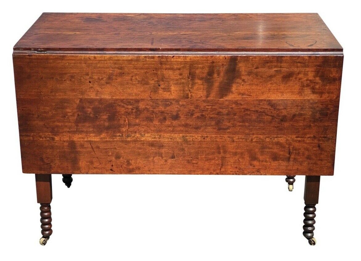 19TH C ANTIQUE SHERATON FIGURED CHERRY DROP LEAF DINING TABLE  W/ SPOOL CARVINGS