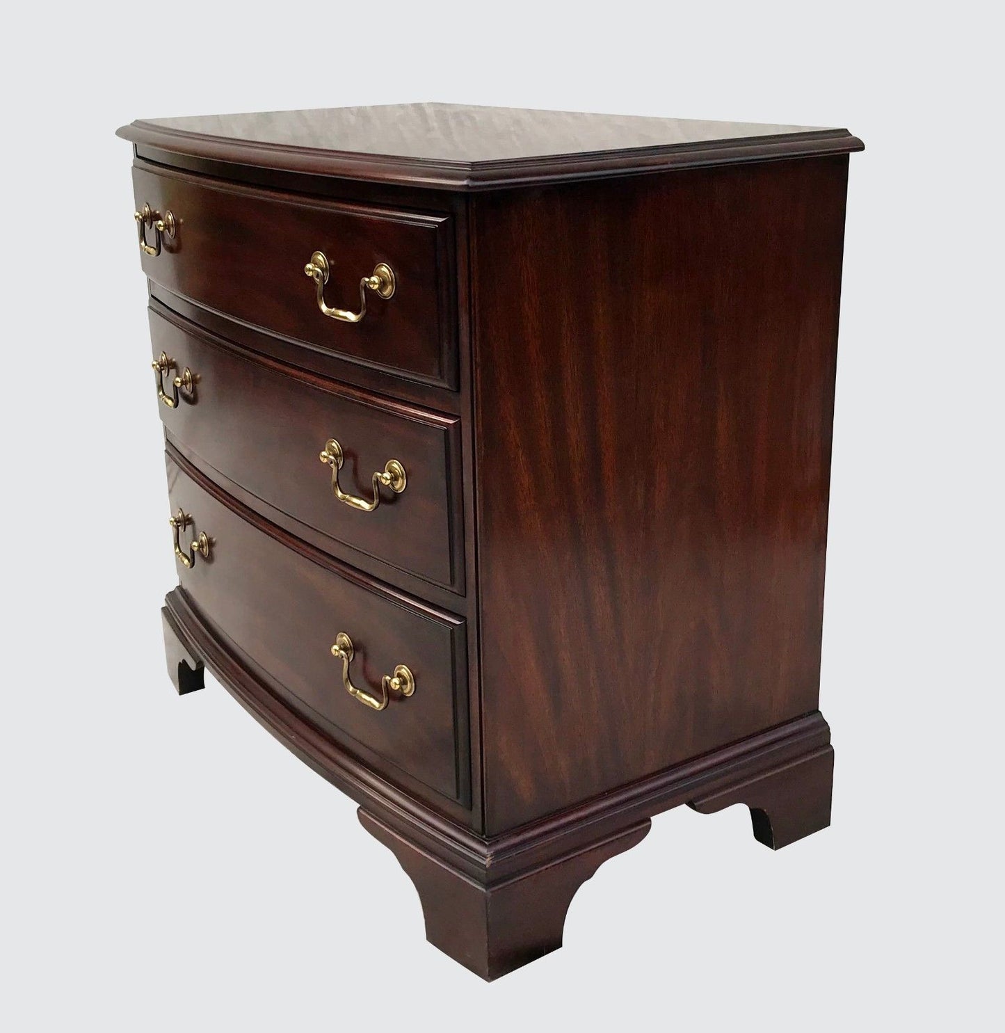 CHIPPENDALE STYLED HENKEL & HARRIS BOW FRONT BACHELORS CHEST WITH WRITING SLIDE