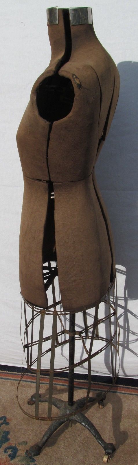 ANTIQUE ACME DRESS FORM ON VICTORIAN CAST IRON BASE