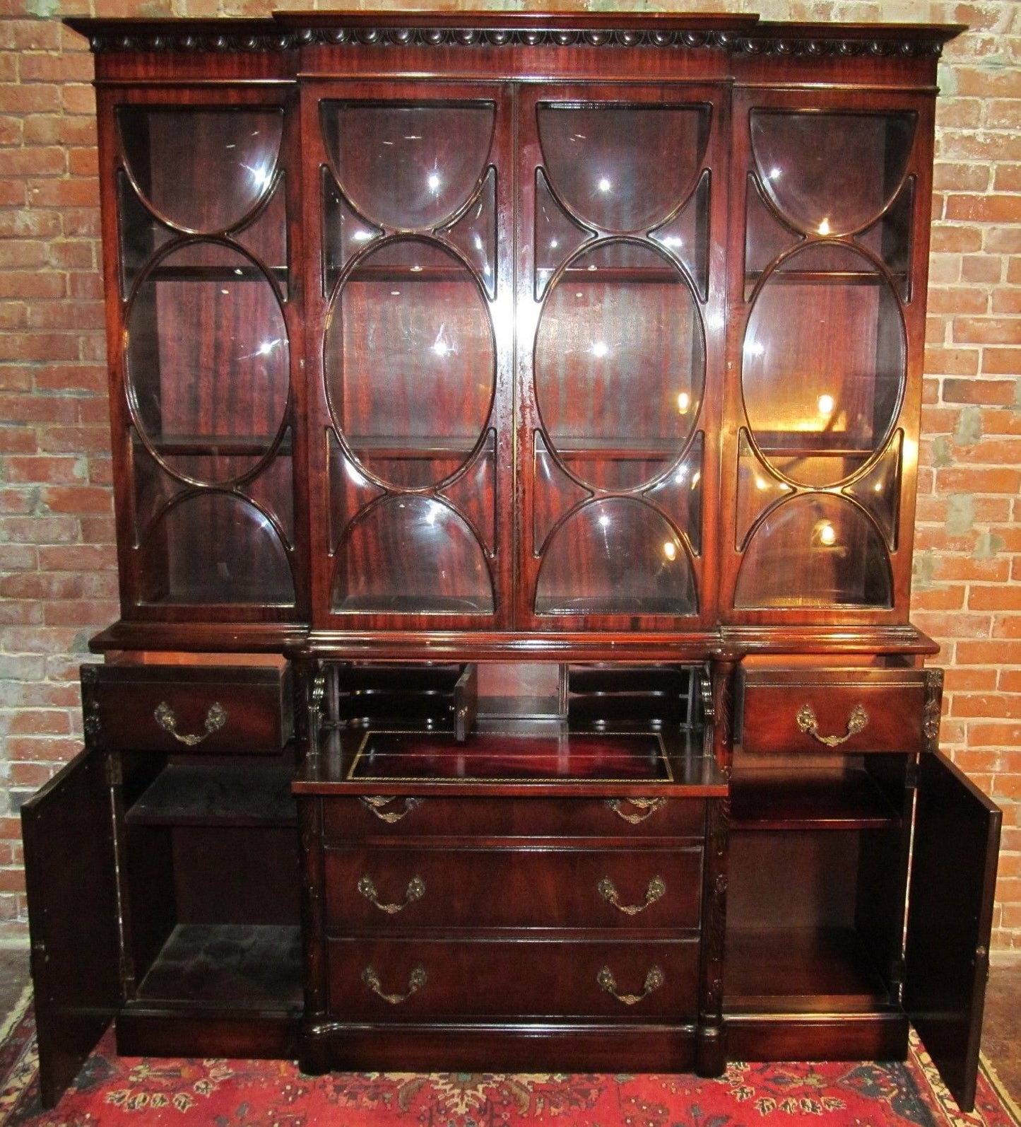 CHIPPENDALE STYLE MAHOGANY BUBBLE GLASS BREAKFRONT WITH BUTLER'S DESK