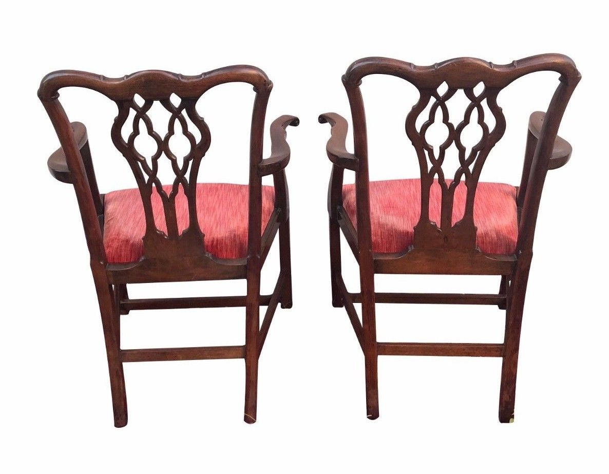 PAIR OF 19TH CENTURY CHIPPENDALE CARVED MAHOGANY ARM CHAIRS WITH ROLLED ARMS