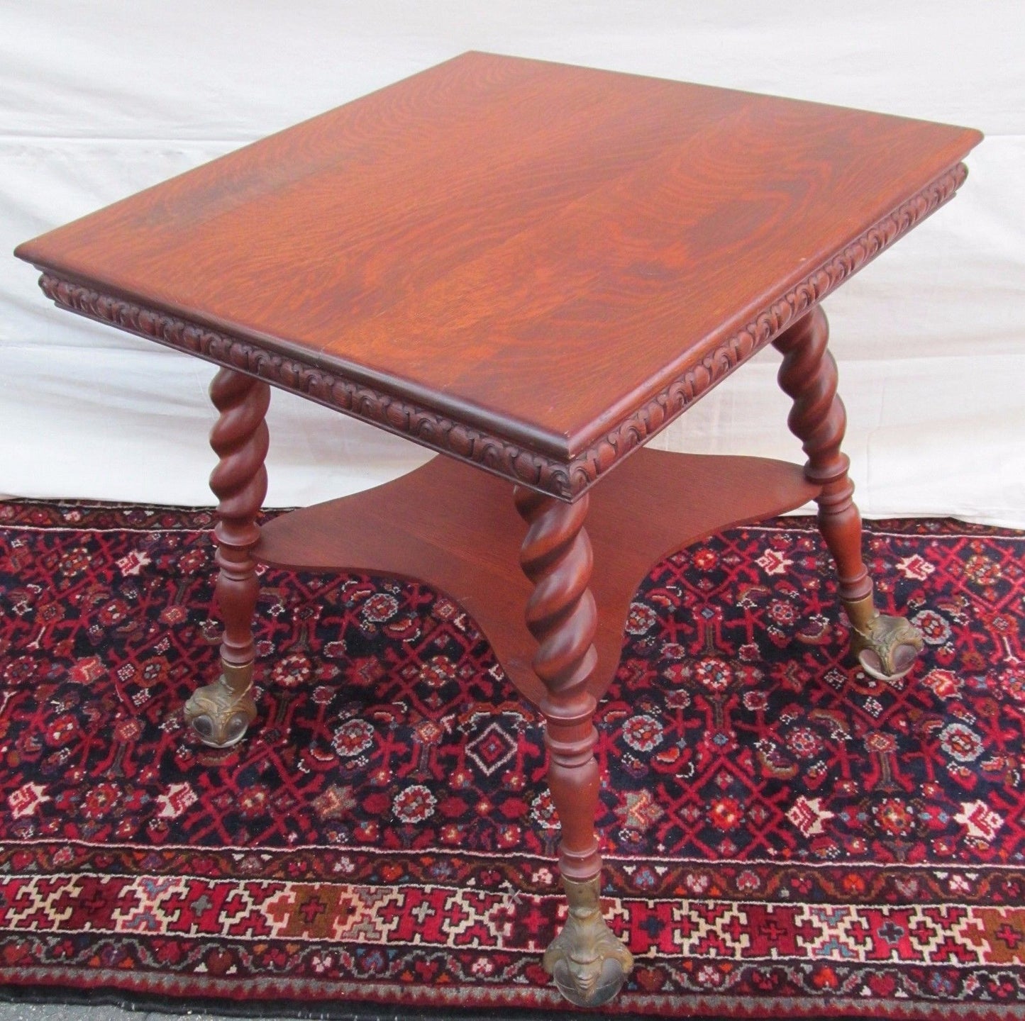 VICTORIAN TIGER OAK PARLOR TABLE WITH GLASS BALL & CAST IRON GROTESQUE HEAD FEET