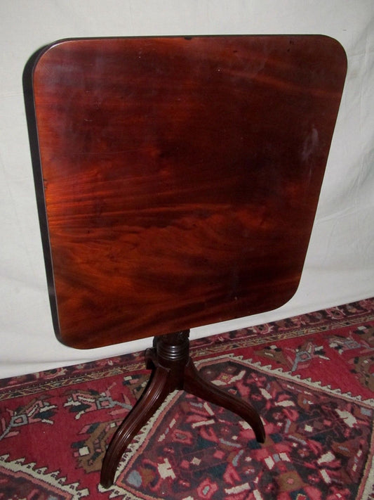 SHERATON SOLID FIGURED MAHOGANY SPIDER LEG TILT TOP TABLE CIRCA 1810