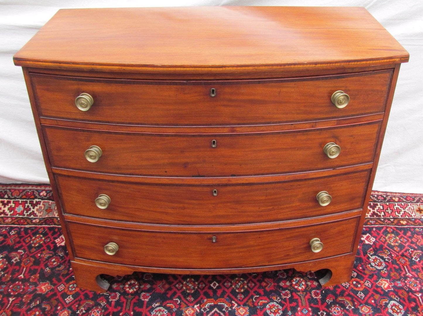 FEDERAL PERIOD BOSTON BOW FRONT MAHOGANY DRESSER ON RARE REVERSE BRACKET BASE