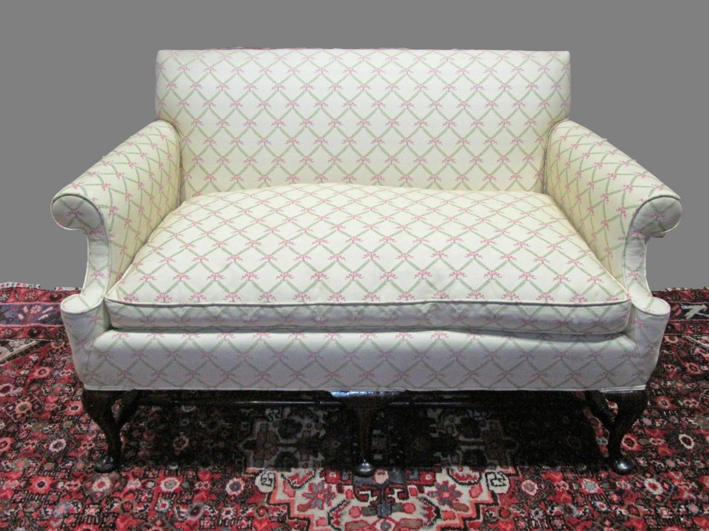 PAIR-QUEEN ANNE STYLED SETTEES ON FINELY FORMED STRETCHER BASES & PAD FEET