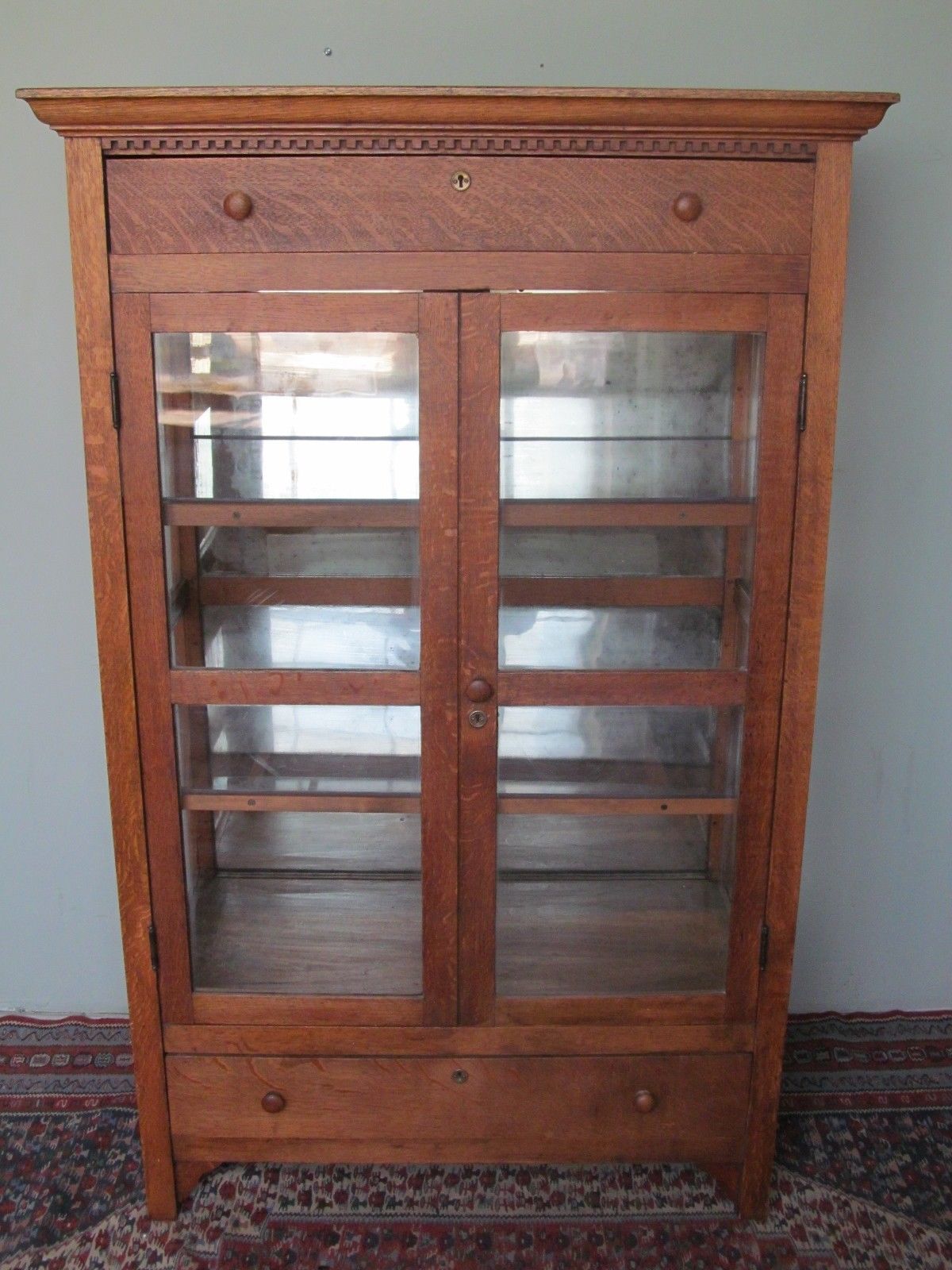 VICTORIAN OAK KITCHEN CABINET WITH CARVED DENTAL WORK MOLDING