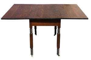 19TH C ANTIQUE SHERATON FIGURED CHERRY DROP LEAF DINING TABLE  W/ SPOOL CARVINGS