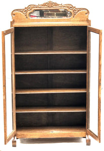 19TH C. VICTORIAN GOLDEN OAK BOOKCASE WITH MIRRORED AND CARVED GALLERY.