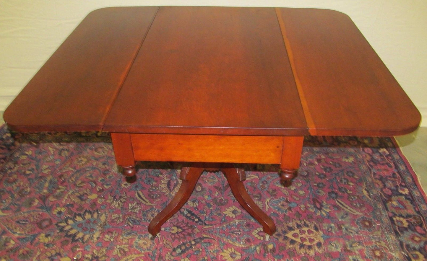 SHERATON NEW ENGLAND CHERRY DROPLEAF BREAKFAST TABLE WITH RARE CARVED BASE