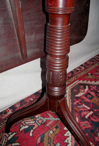 SHERATON SOLID FIGURED MAHOGANY SPIDER LEG TILT TOP TABLE CIRCA 1810