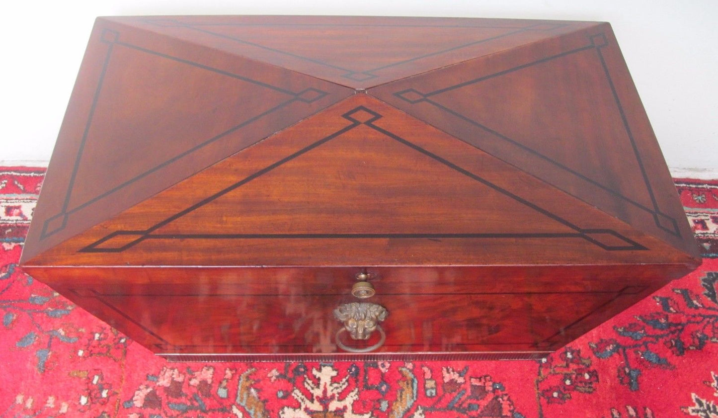 GEORGE III PERIOD MAHOGANY EBONY INLAID SARCOPHAGUS FORMED CELLARETTE