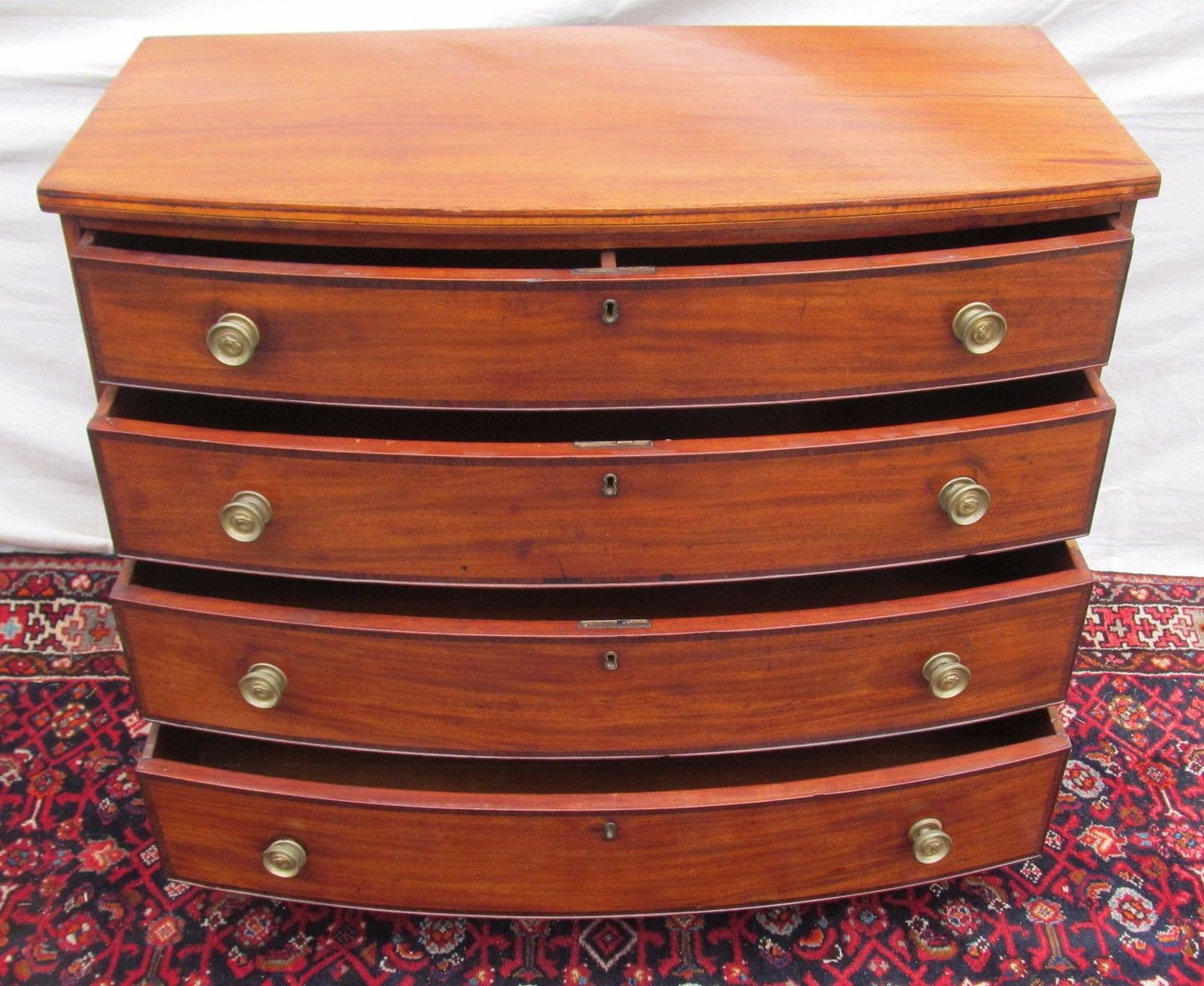 FEDERAL PERIOD BOSTON BOW FRONT MAHOGANY DRESSER ON RARE REVERSE BRACKET BASE