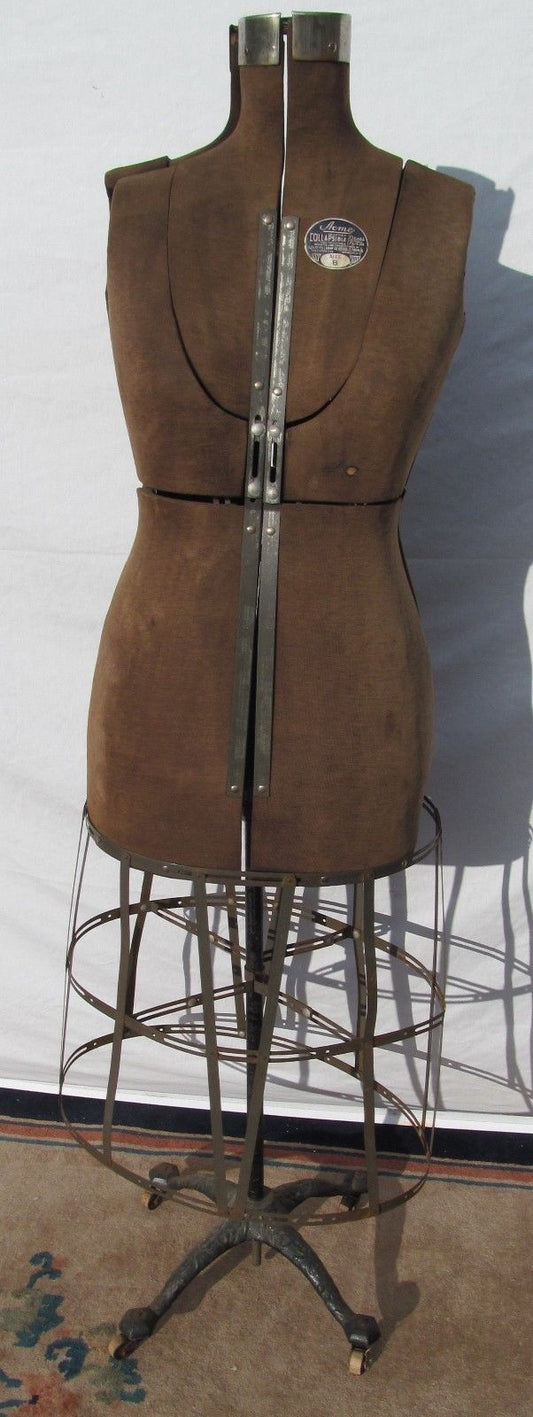 ANTIQUE ACME DRESS FORM ON VICTORIAN CAST IRON BASE